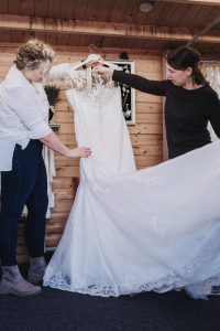Bride choosing a dress in a bridal boutique